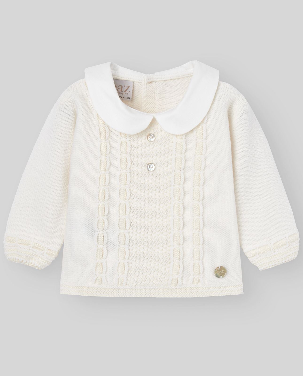 A baby is wearing a white sweater with a white collar.;A baby is wearing a white sweater with a white collar.;A pair of white knitted baby pants with feet on a white background.;A pair of white baby pants with feet on a white background.