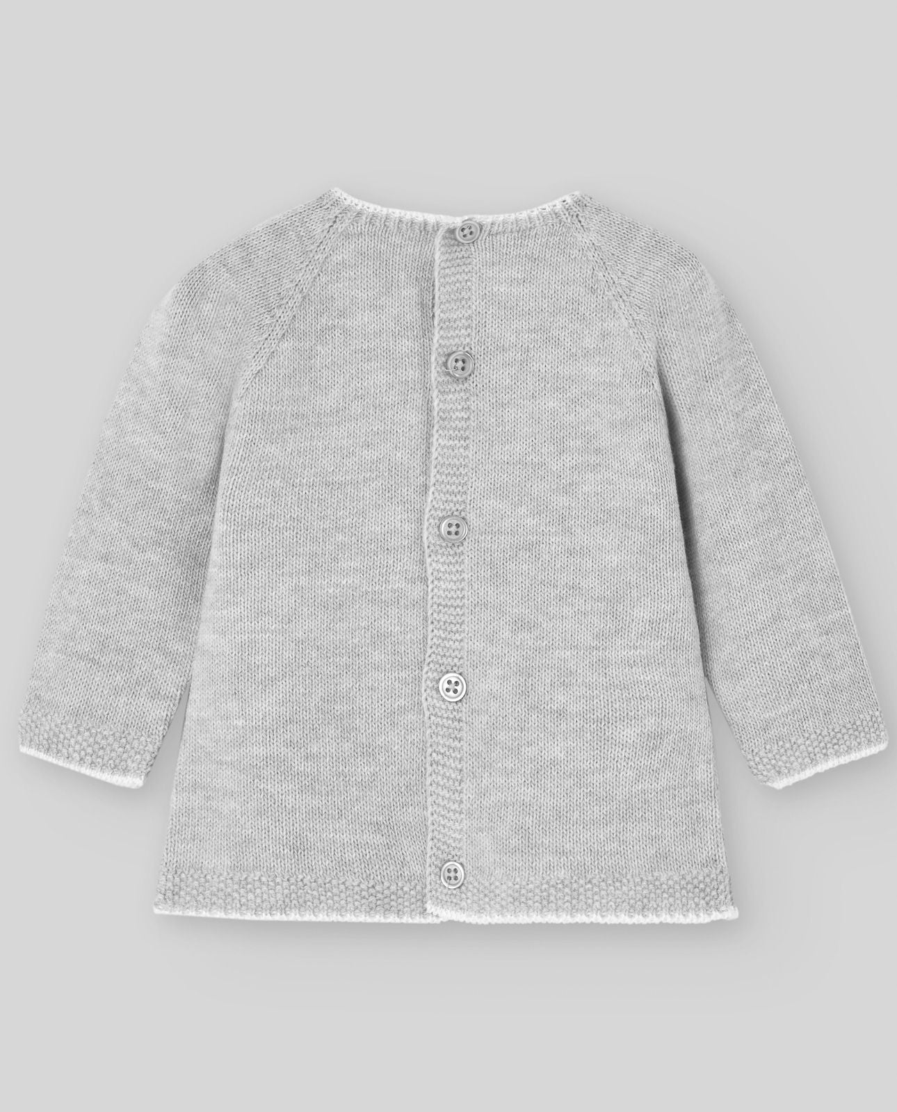 A baby girl is wearing a grey sweater with white trim.;A baby is wearing a grey sweater with white buttons on the back.;A pair of gray knitted pants with feet on a white background.;A pair of gray knitted pants with feet on a white background.