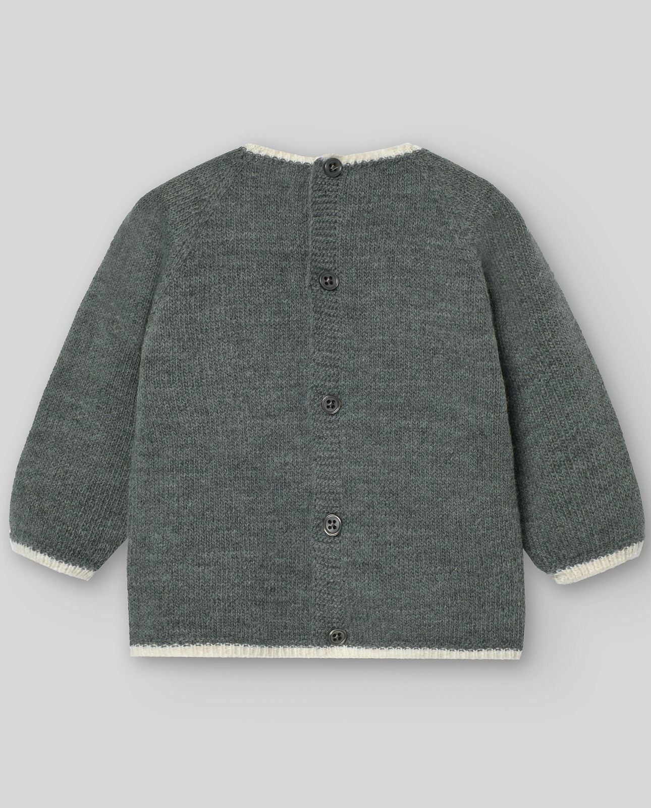 A baby is wearing a sweater and pants with a snowflake on it.;A grey sweater with a white snowflake on it.;A baby is wearing a grey sweater with white trim.;A pair of grey baby pants with feet on a white background.