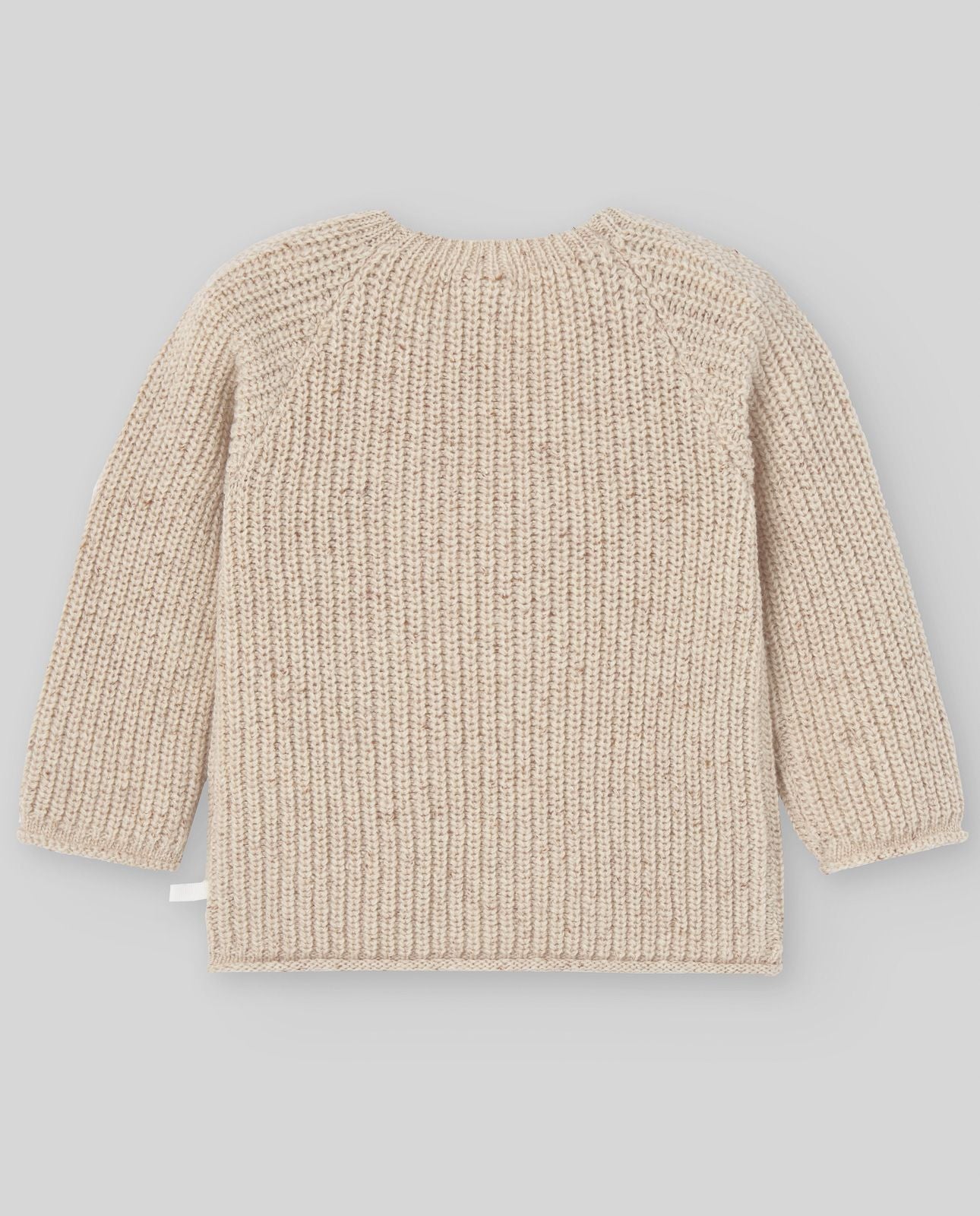 A baby is wearing a beige sweater with buttons on the sleeves.;A close up of a beige sweater with long sleeves on a white background.;A pair of beige pants with a pattern on them on a white background.;A pair of beige pants with a pattern on them