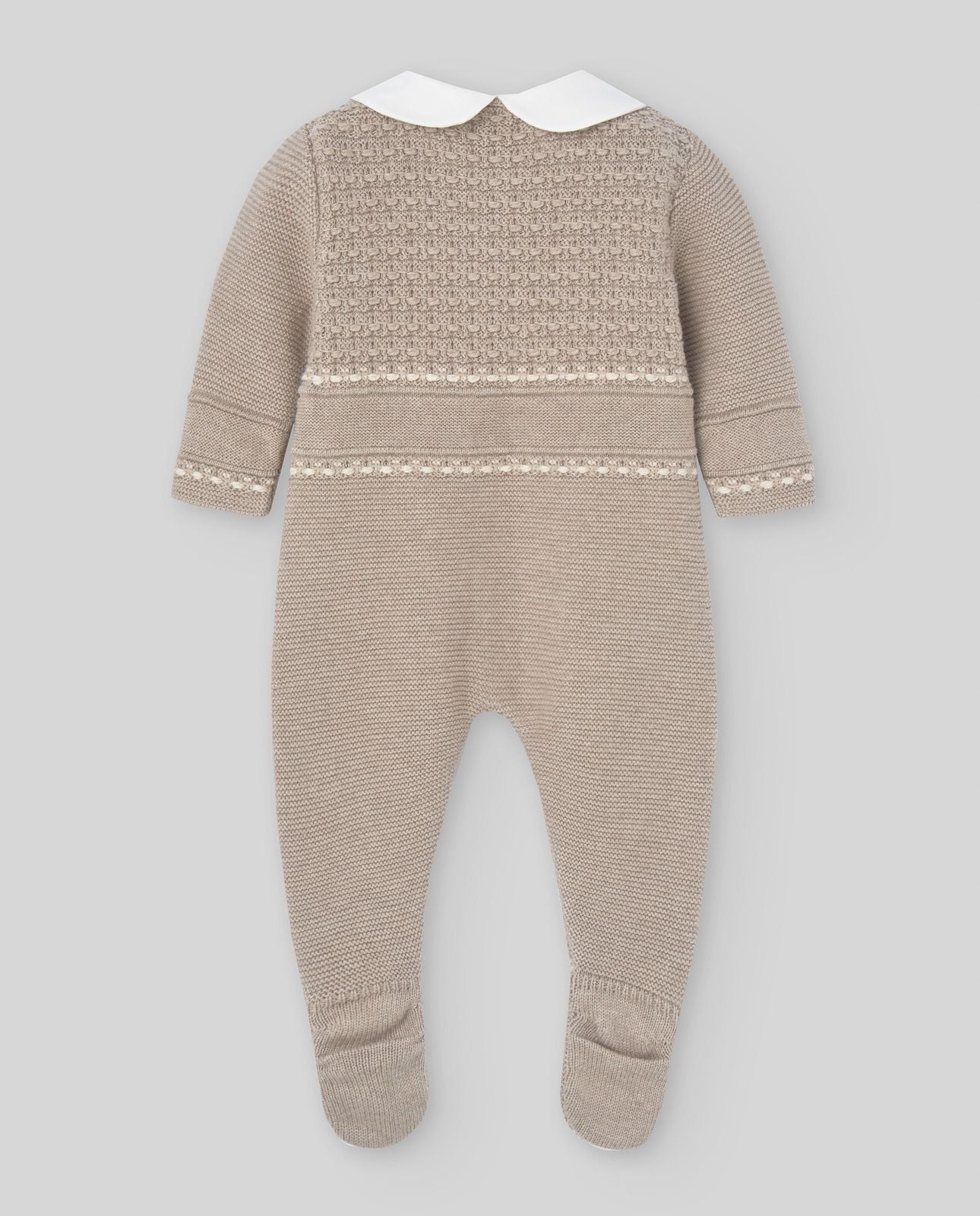A baby is wearing a knitted onesie with a white collar.;A baby is wearing a knitted outfit with a white collar.