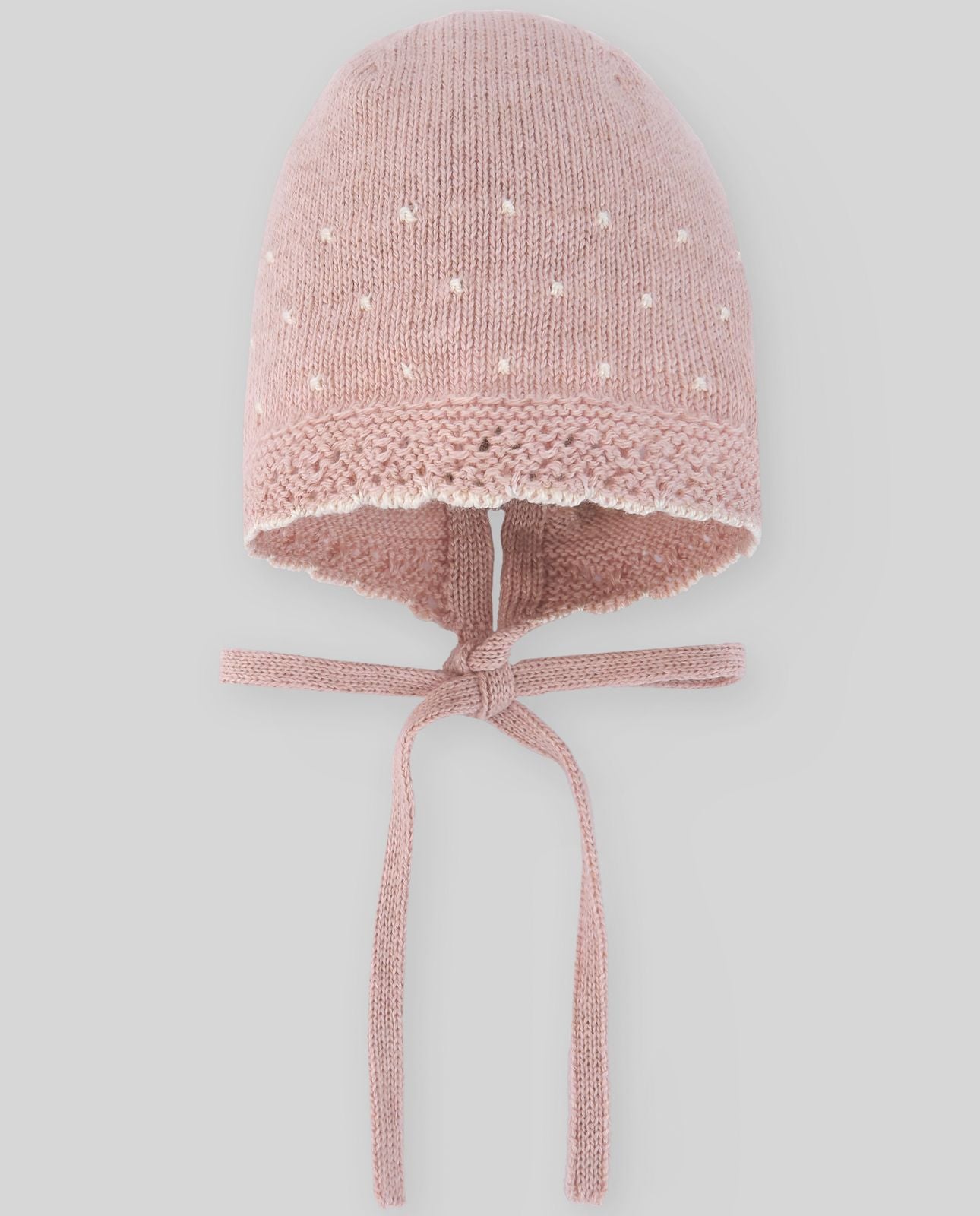 A pink knitted hat with a tie around the neck;A pink knitted hat with a white flower on it