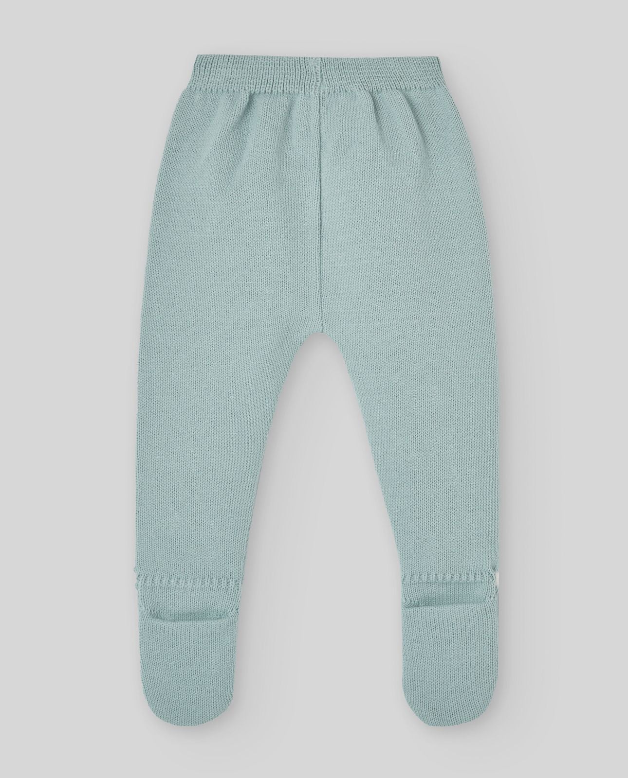 A baby is wearing a green sweater with a white collar.;A baby is wearing a green sweater with a white collar.;A pair of knitted baby pants with feet on a white background.;A pair of baby pants with feet on a white background.;A baby is laying on a bed wearing a hat and a sweater.