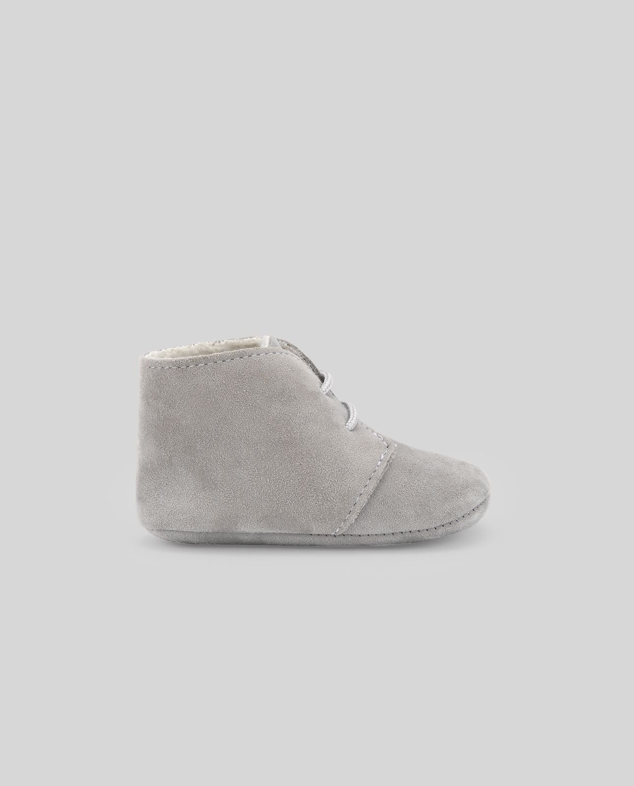 A pair of white baby shoes with white laces on a white background.;A pair of white baby shoes with white laces on a white background.;A pair of grey baby shoes with white laces on a white background.;A pair of grey baby shoes on a white background.;A pair of blue baby shoes with white laces