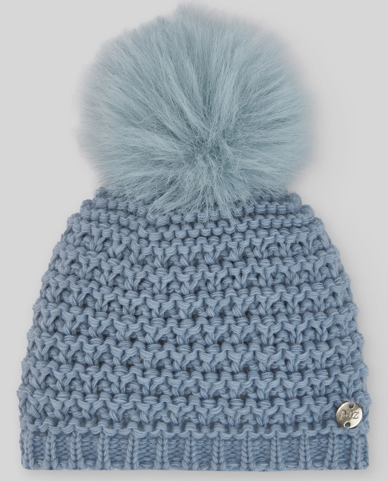 A light blue knitted hat with a blue pom pom;A blue knitted hat with a pom pom on top.