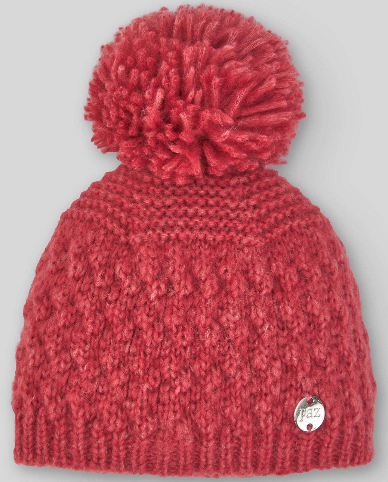 A red knitted hat with a large red pom pom
