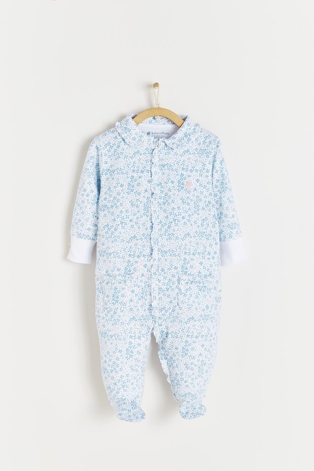 A baby onesie is hanging on a hanger on a white background.;The back of a baby onesie is hanging on a hanger.;A close up of a white shirt with blue flowers on it.;A baby onesie with blue flowers on it is hanging on a wooden hanger.