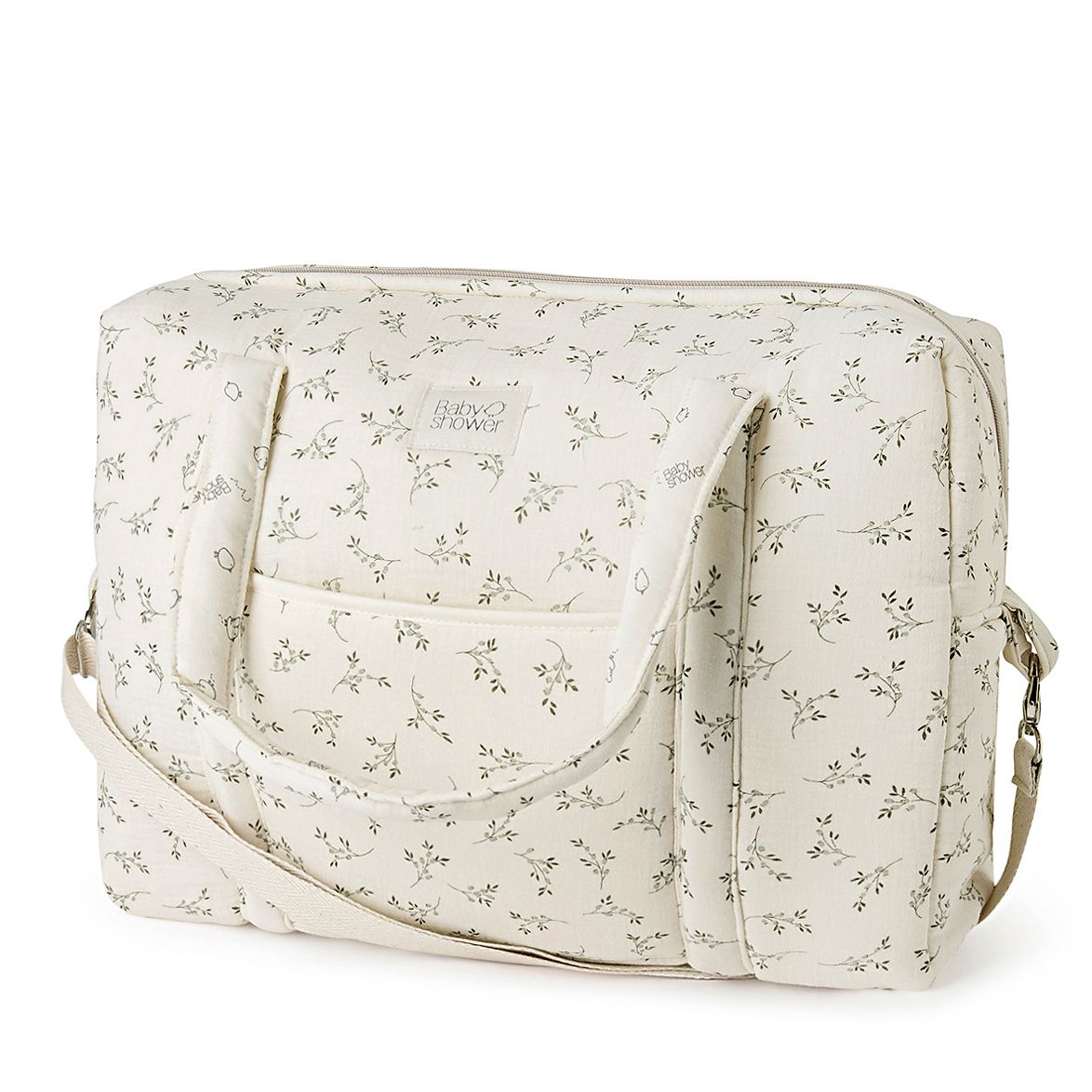 A grey diaper bag with a white strap and letters on it;A white diaper bag with a floral pattern on it;A white diaper bag with black flowers on it;A floral diaper bag with a white strap on a white background.;A green diaper bag with white handles and a white strap on a white background.;A floral diaper bag with a white strap on a white background.;A white diaper bag with a floral pattern on it