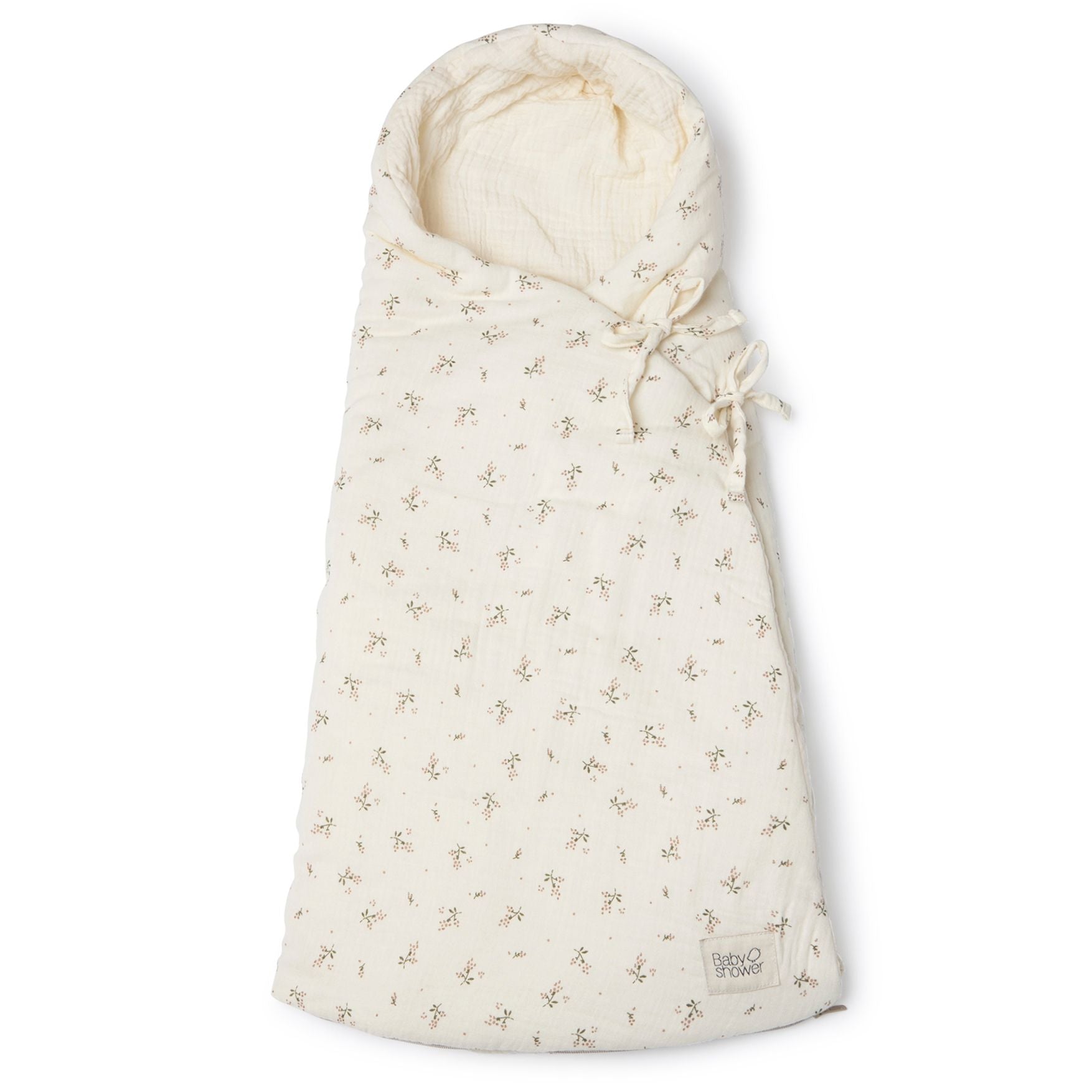 A white blanket with polka dots on it;A baby sleeping bag with a floral pattern on it;A white blanket with a hood and flowers on it;A close up of a blanket with flowers on it;A white blanket with a hood and flowers on it;A white and grey blanket with a floral pattern on it