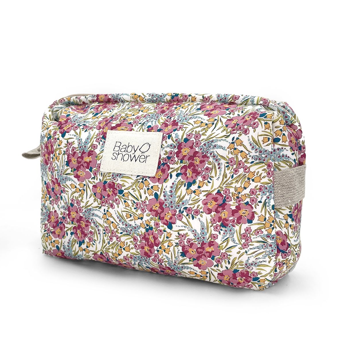 A cosmetic bag with a floral pattern on it is on a white background.