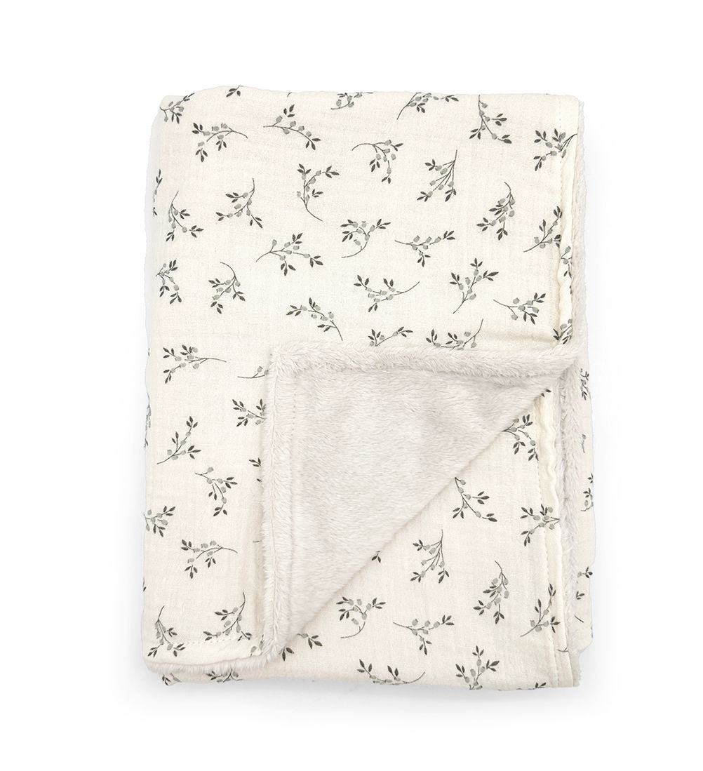 A white blanket with a bow on it on a white background.;A white blanket with black flowers on it;A white blanket with a floral pattern on it;A blanket is wrapped in a ribbon and tied with a bow.;A blanket with a floral pattern on it on a white background.;A blanket with a bow on it is rolled up on a white background.