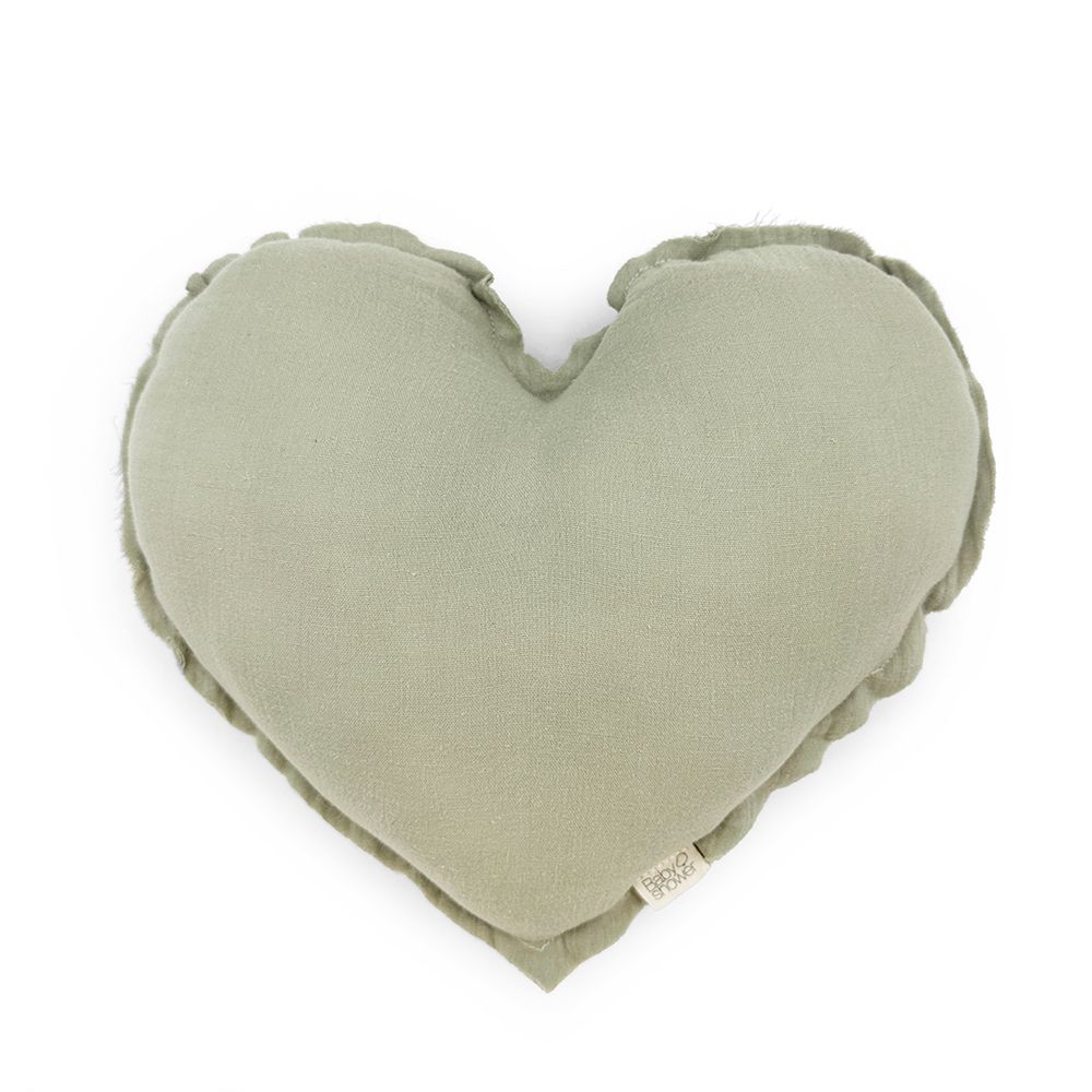 A green heart shaped pillow on a white background.