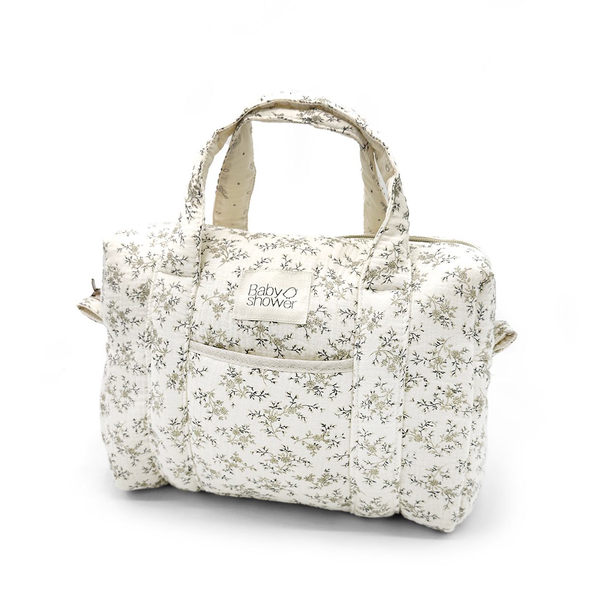 A white purse with a floral pattern and a handle on a white background.
