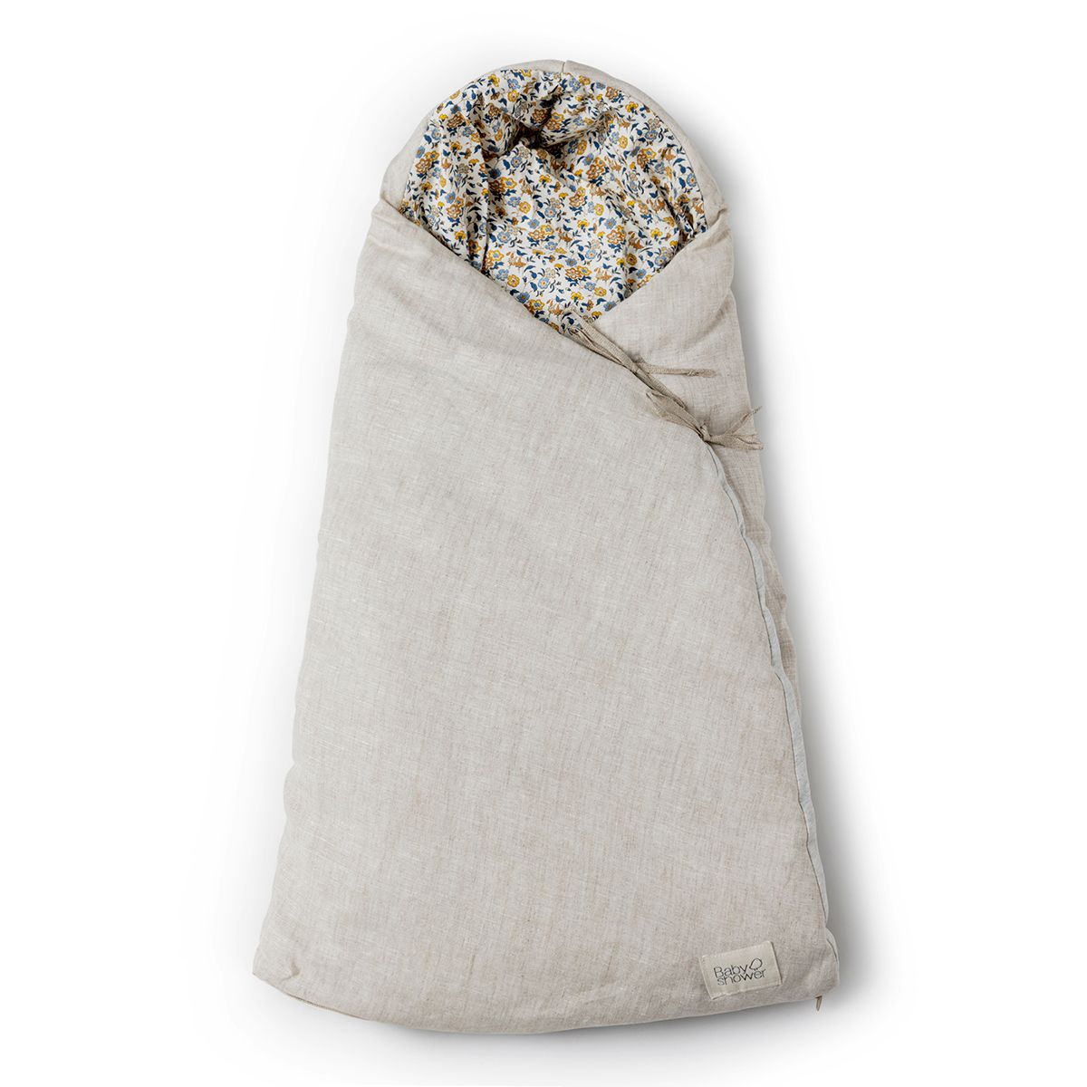A beige blanket with a floral pattern on it
