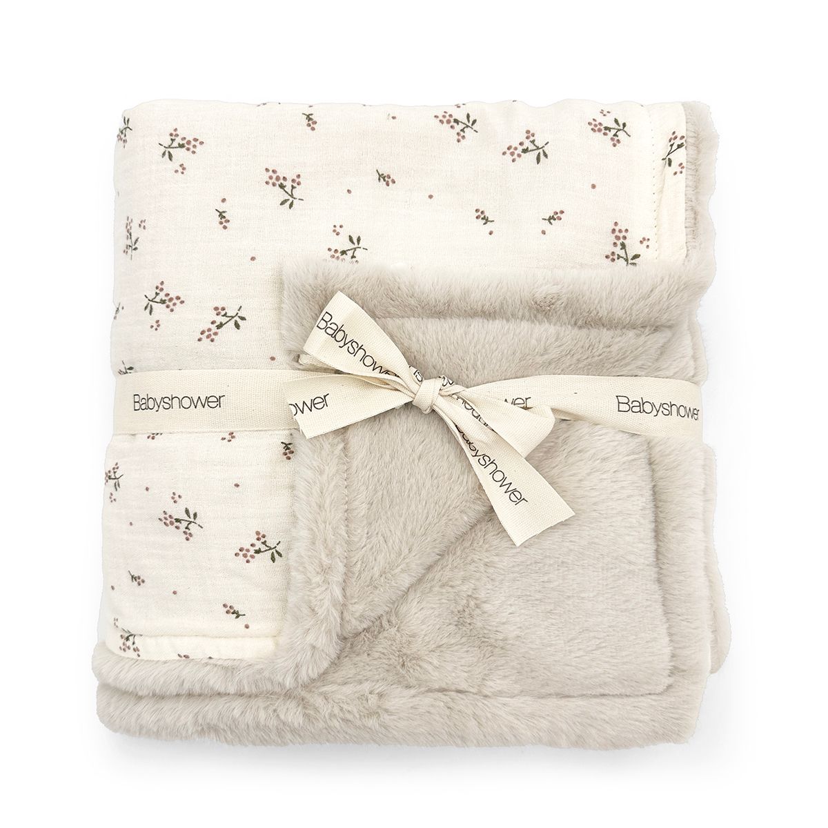 A white blanket with a bow on it on a white background.;A white blanket with black flowers on it;A white blanket with a floral pattern on it;A blanket is wrapped in a ribbon and tied with a bow.;A blanket with a floral pattern on it on a white background.;A blanket with a bow on it is rolled up on a white background.