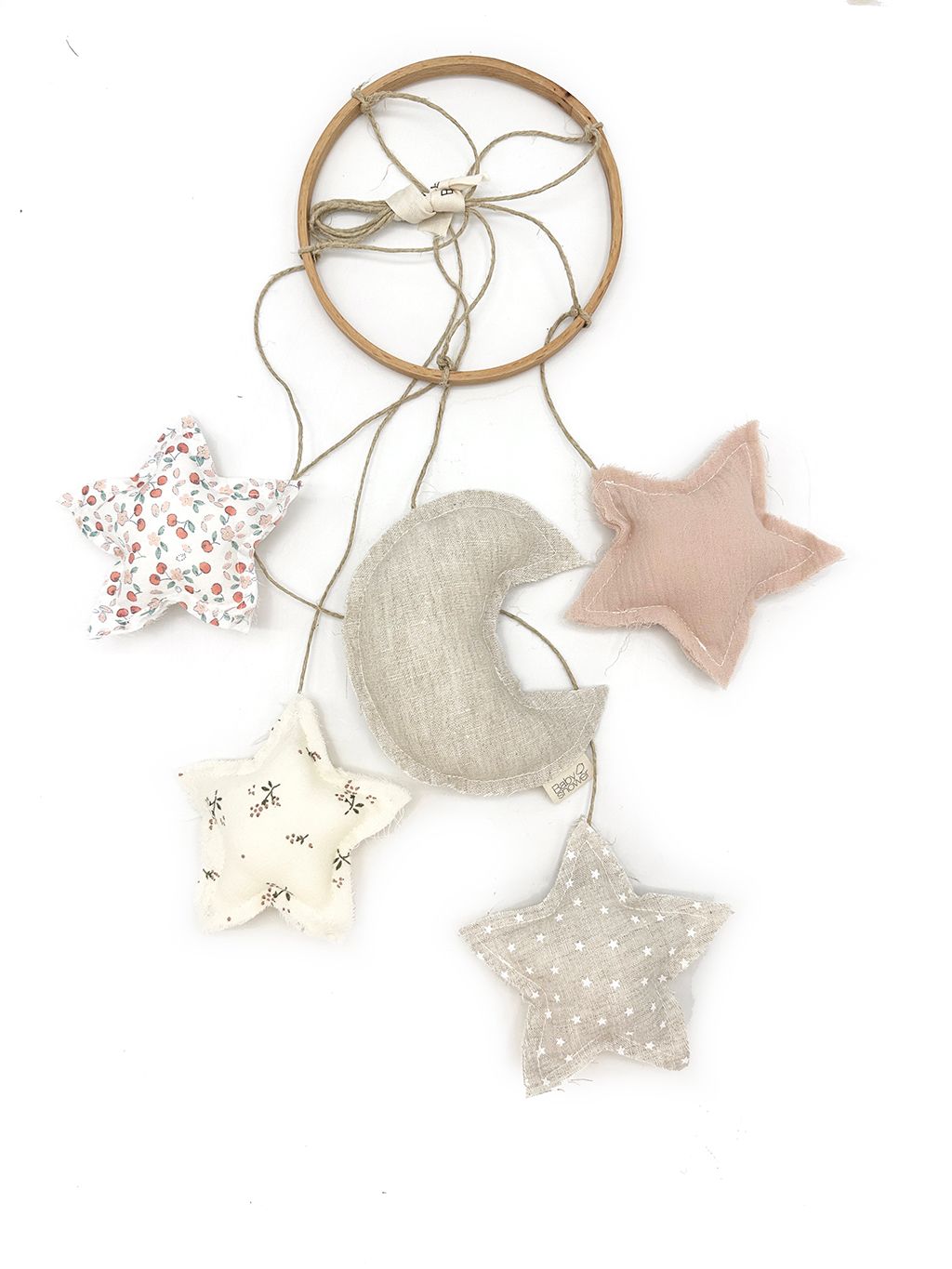 A dream catcher with a crescent moon and stars hanging from it.