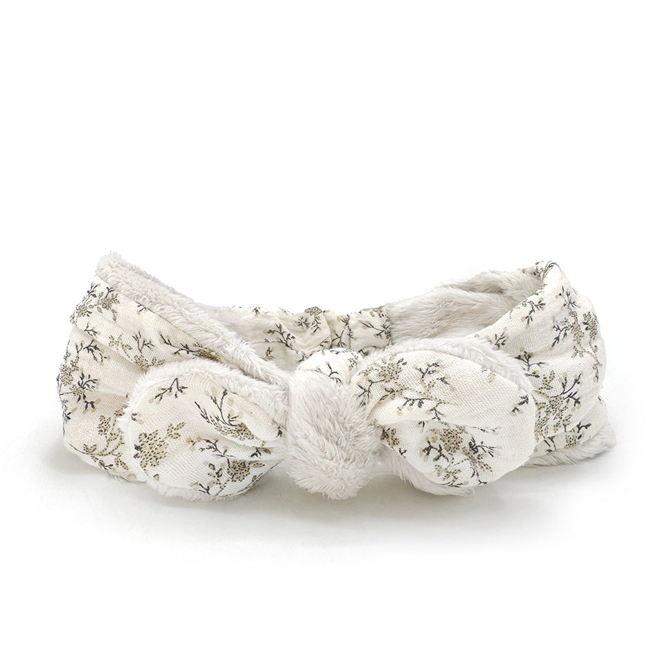 A white headband with a knot in the middle on a white background.