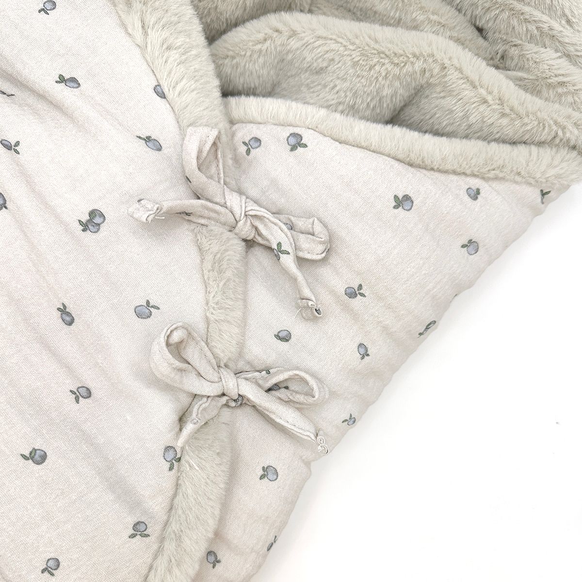 A close up of a blanket with fish on it
