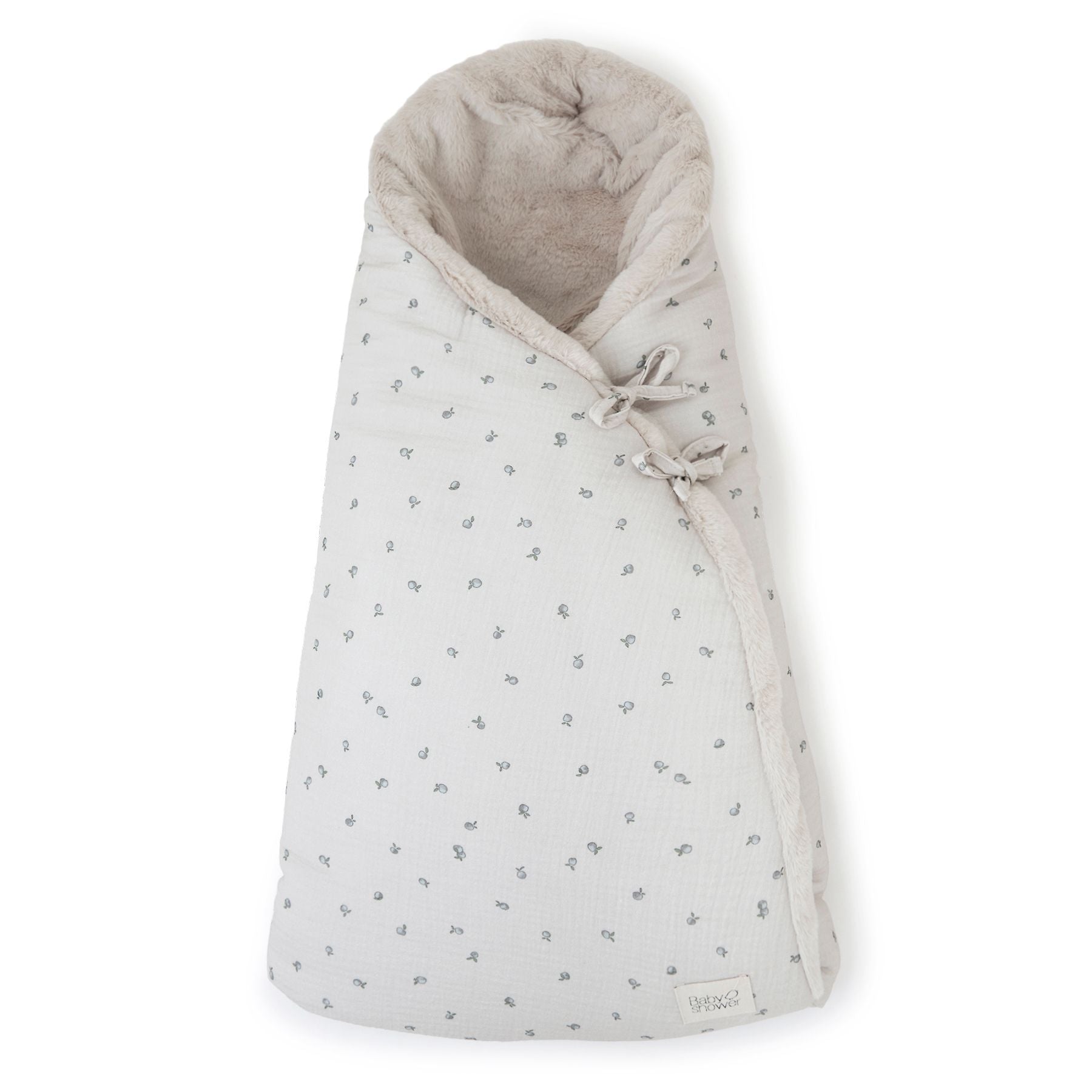 A white blanket with polka dots on it;A baby sleeping bag with a floral pattern on it;A white blanket with a hood and flowers on it;A close up of a blanket with flowers on it;A white blanket with a hood and flowers on it;A white and grey blanket with a floral pattern on it