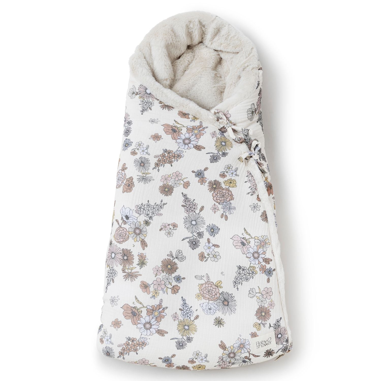 A baby sleeping bag with a floral pattern on it