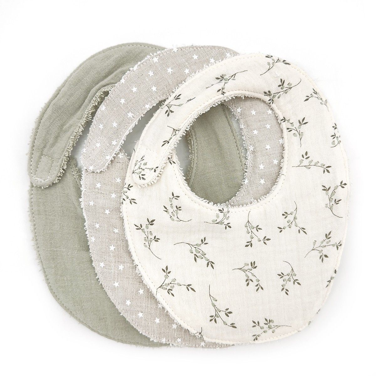 Three bibs are stacked on top of each other on a white background.