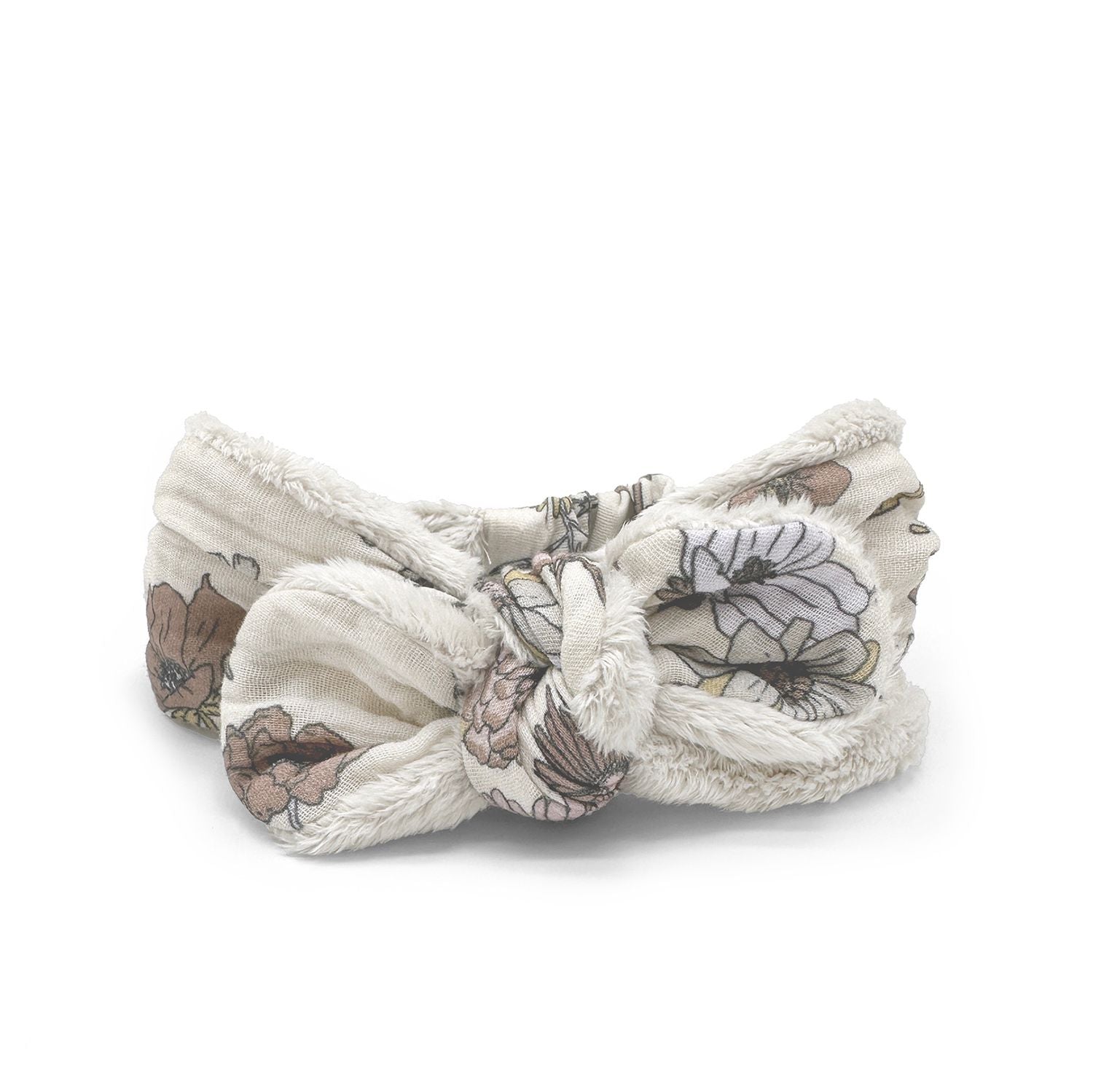 A white headband with a bow on it on a white background.