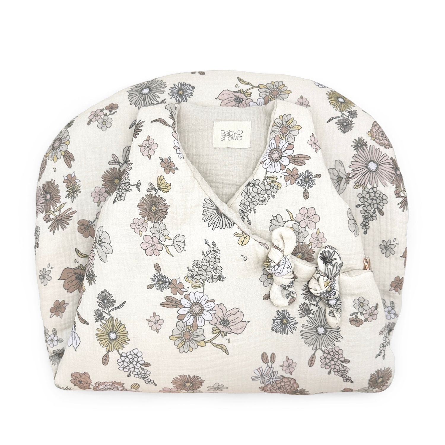 A white sweater with a floral pattern on it