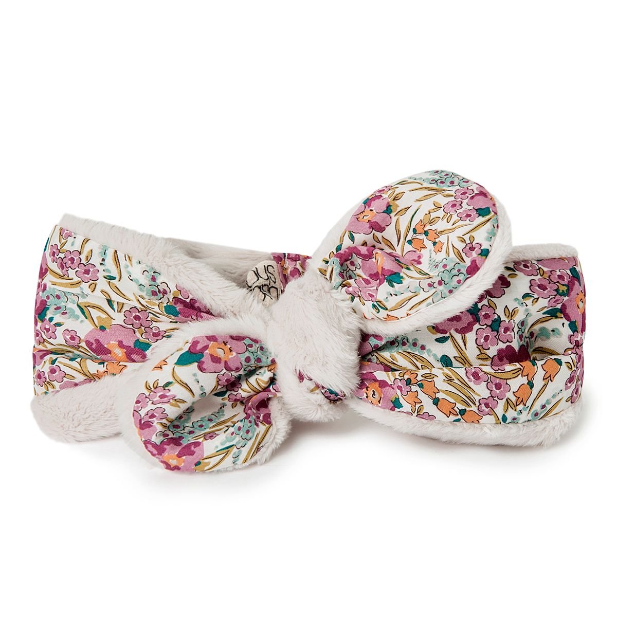 A white headband with a floral pattern on it
