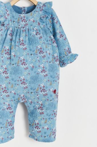 A baby in a blue floral jumpsuit is hanging on a hanger.;A baby 's blue floral jumpsuit is hanging on a wooden hanger.;A baby 's blue floral jumpsuit is hanging on a hanger.;A blue dress with flowers and mushrooms on it
