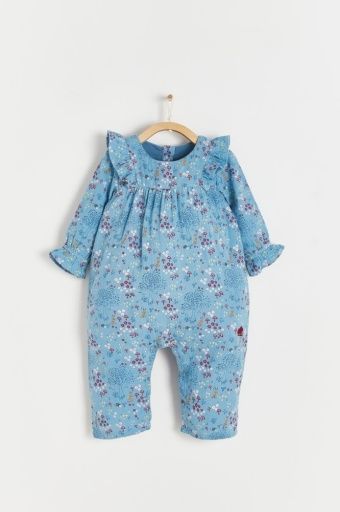 A baby in a blue floral jumpsuit is hanging on a hanger.;A baby 's blue floral jumpsuit is hanging on a wooden hanger.;A baby 's blue floral jumpsuit is hanging on a hanger.;A blue dress with flowers and mushrooms on it