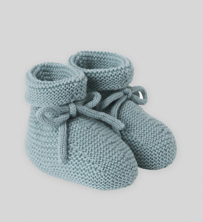 A pair of blue knitted baby booties with laces