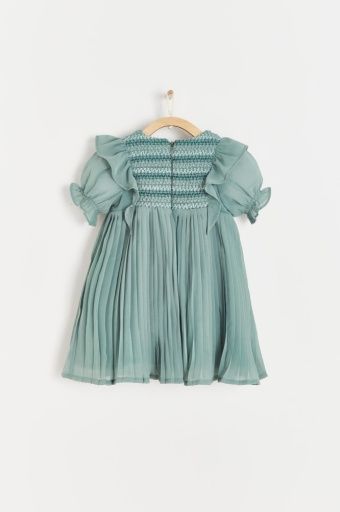 A green pleated dress is hanging on a wooden hanger.;A green dress with short sleeves is hanging on a hanger.;A close up of a green pleated skirt with ruffles on the bottom.
