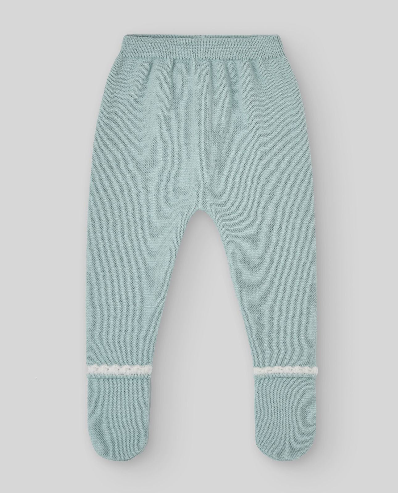 A baby is wearing a green sweater with a white collar.;A baby is wearing a green sweater with a white collar.;A pair of knitted baby pants with feet on a white background.;A pair of baby pants with feet on a white background.;A baby is laying on a bed wearing a hat and a sweater.