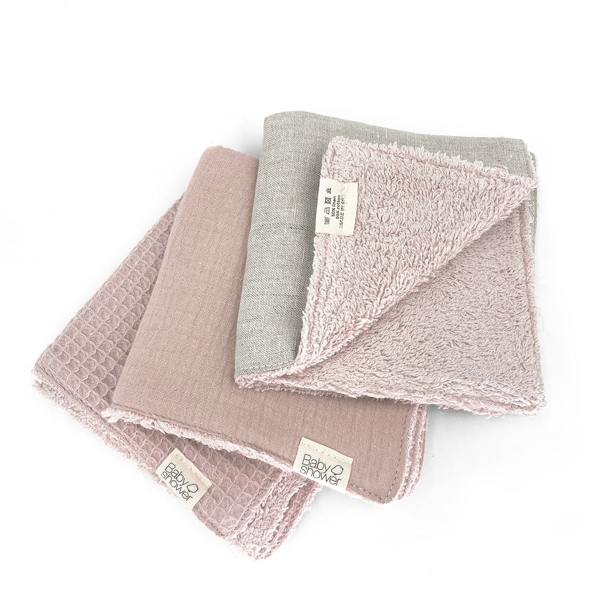 Three towels are stacked on top of each other on a white background.