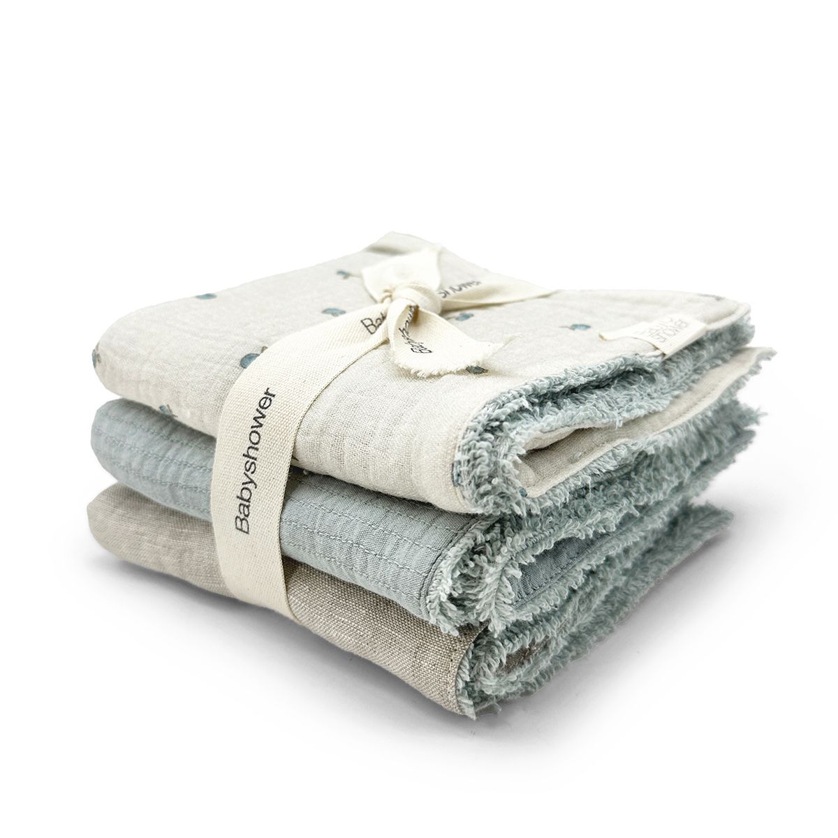 Three towels are stacked on top of each other on a white background.