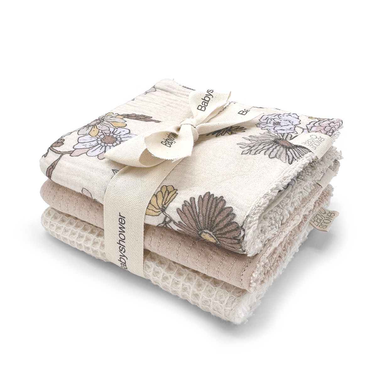 A stack of towels with a bow on a white background.