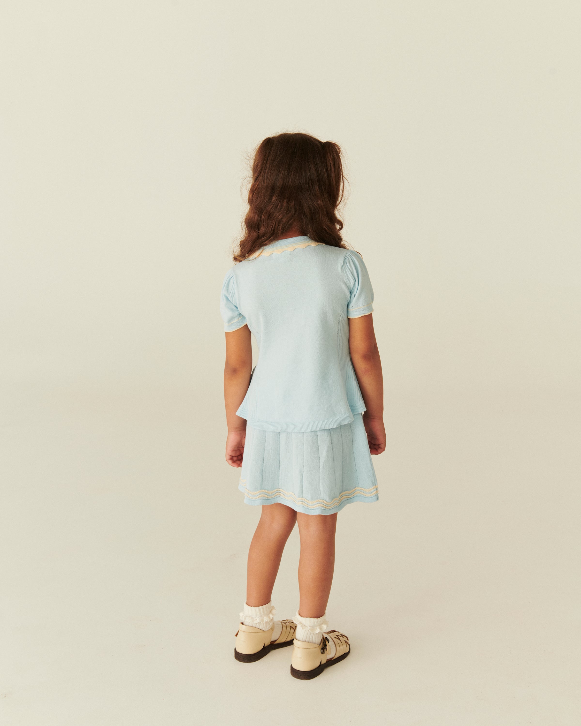 KNITTED PEPLUM BLOUSE