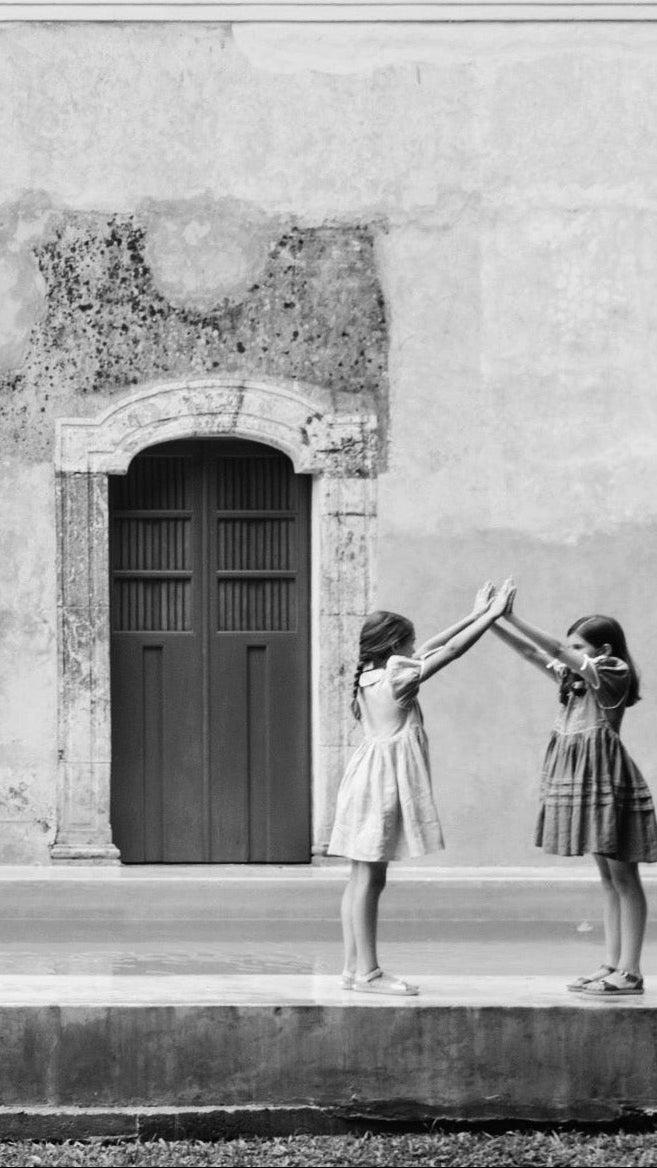 Two kids holding hands