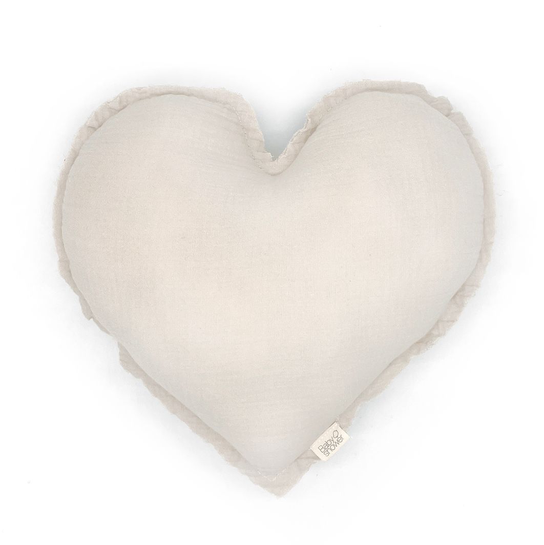 A green heart shaped pillow on a white background.;A white heart shaped pillow on a white background.;A white heart shaped pillow on a white background.;A heart shaped pillow is sitting on a white surface.;A baby is sleeping under a canopy with a mobile hanging from it.
